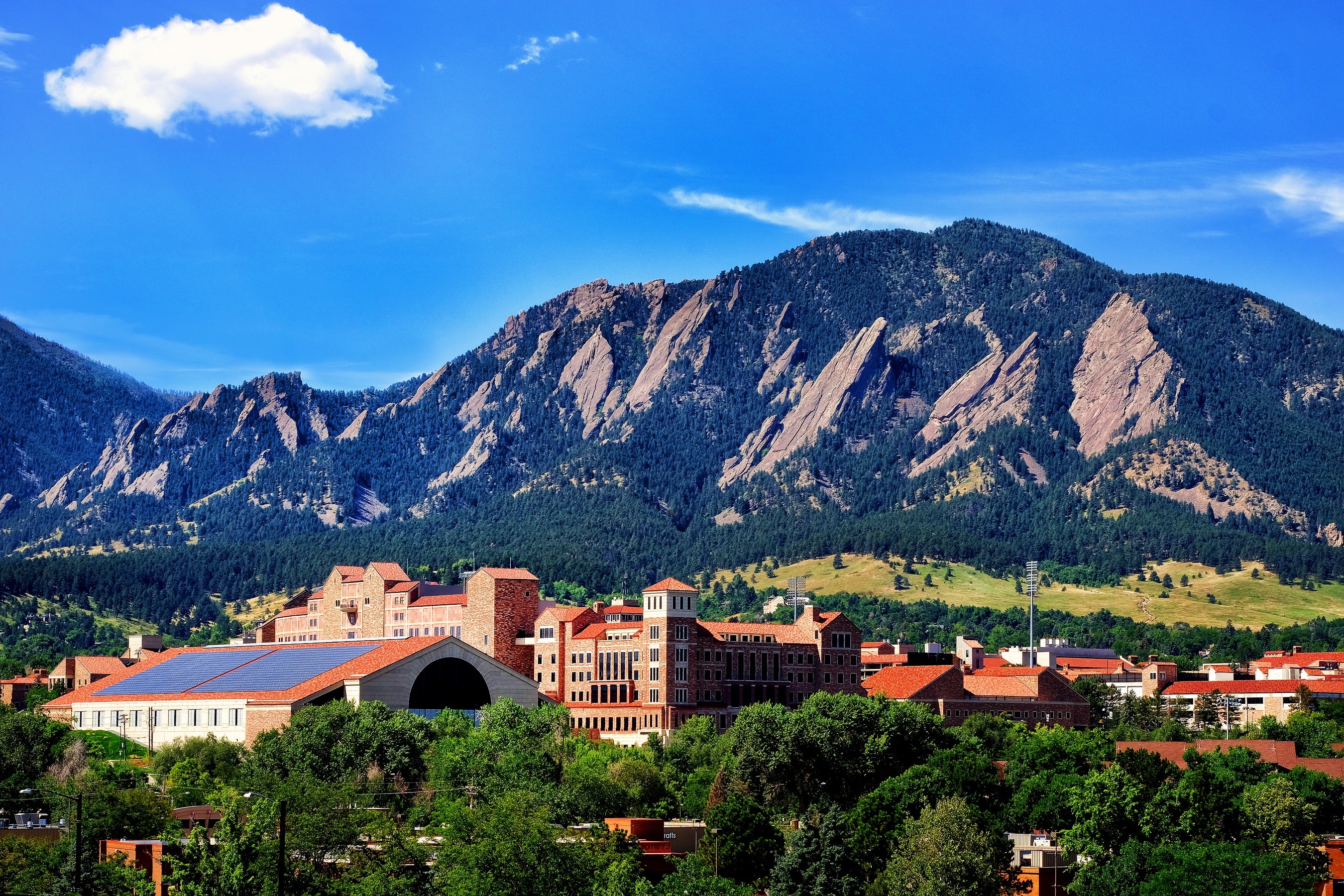 CU Boulder campus with the Flatirons rising behind it